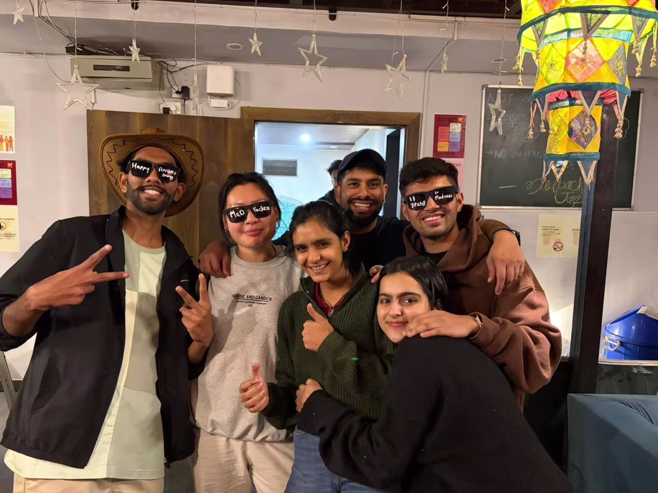 Madpackers guests together in the hostel common room
